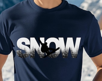 May include: A navy blue t-shirt with a white graphic of the word "SNOW" with a silhouette of a snowboarder in the middle of the word.