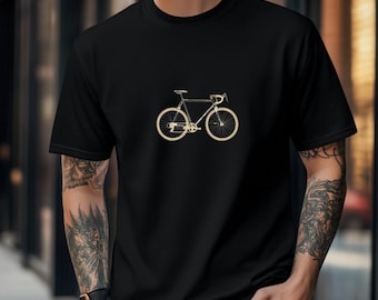 May include: A black t-shirt with a gold outline of a bicycle on the front.
