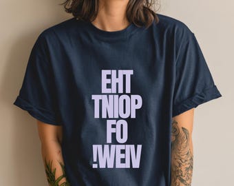 May include: Navy blue t-shirt with the text "EHT TNIOF FO !WEIV" in a light purple color. The shirt has short sleeves and a relaxed fit. The text is stacked vertically, creating a bold graphic design.