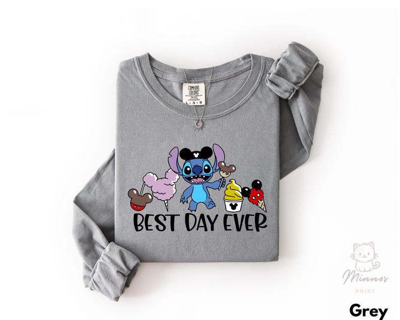 A gray long-sleeved t-shirt with a cartoon character and text printed on it.