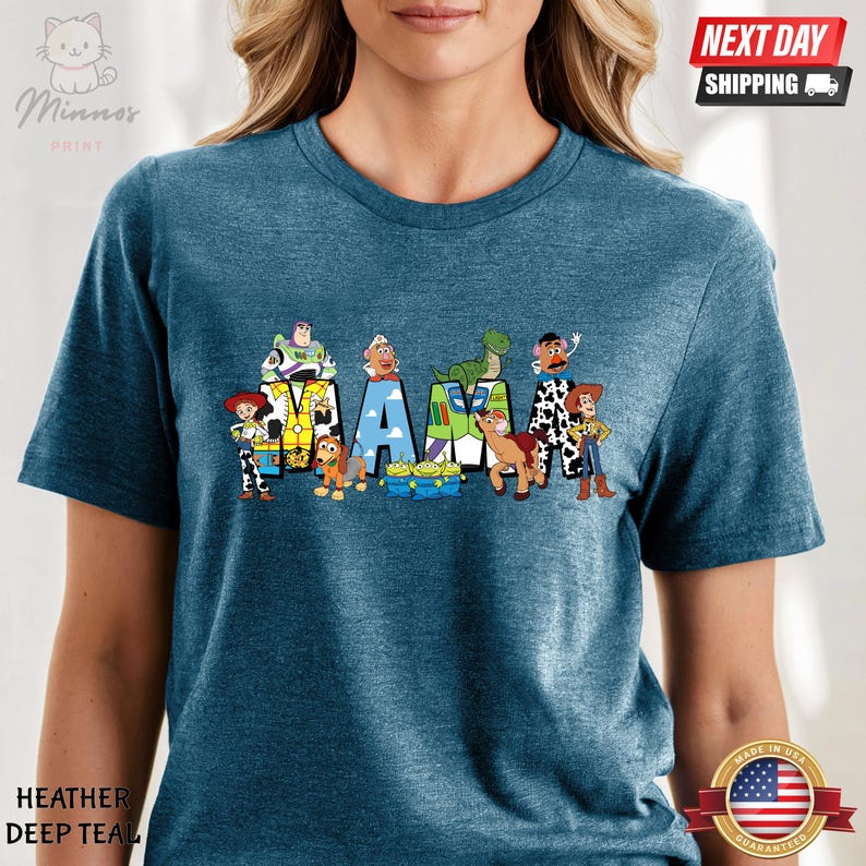 May include: A blue t-shirt with a graphic of the Toy Story characters spelling out "MAMA".