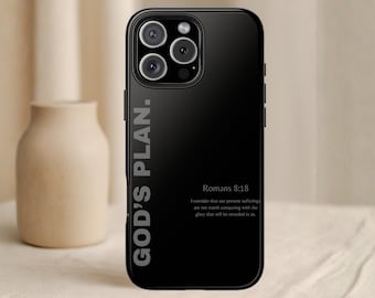 May include: Black phone case with the text "GOD'S PLAN." vertically on the left side. The case also features the text "Romans 8:18" and a Bible verse. The phone case has a glossy finish and a camera bump.