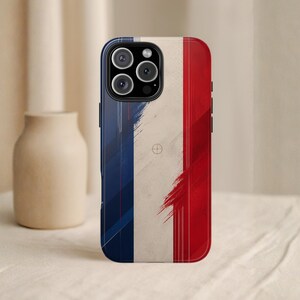 May include: A phone case featuring the French flag design. The case has a blue border and a tricolor design of blue, white, and red. The design has a distressed, brushstroke effect. The phone case has a camera cutout with three lenses.
