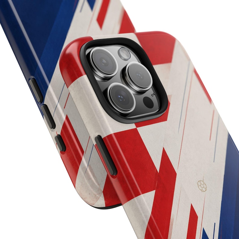 May include: A close-up of a phone case with a Union Jack design. The case features a pattern of red and white stripes and blue sections. The phone's camera lenses are visible.