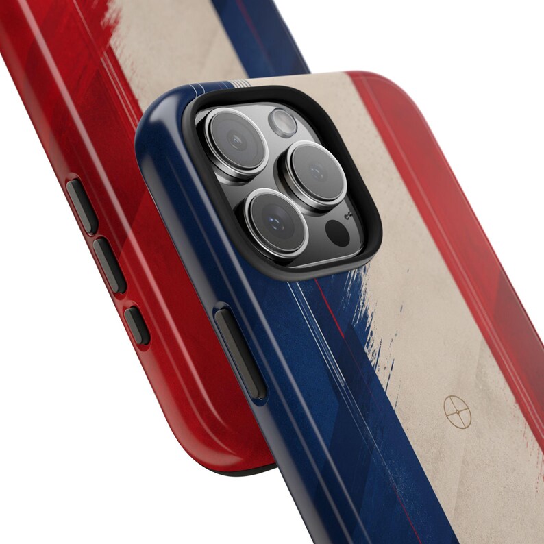 May include: Close-up of two phone cases. One case is red, the other is blue with a red and white stripe design. The cases have a glossy finish and a camera lens cutout. The design resembles a flag.