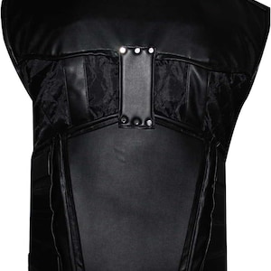 May include: Black leather vest with a quilted fabric panel and a rectangular leather accent secured with silver rivets. The vest has a structured design with a high neckline and a tailored fit.