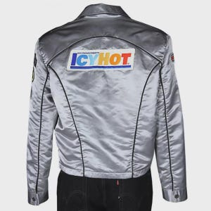 May include: A silver satin jacket with black piping and a "ICYHOT" patch on the back. The jacket has a zipper closure and a collar.