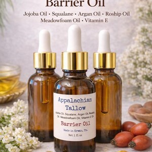 May include: Three amber glass bottles of Appalachian Tallow Barrier Oil with white droppers and gold collars. The label lists ingredients like Jojoba Oil and Vitamin E. The bottles are 1 fl oz each.