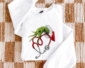 Sudadera con ilustración de estetoscopio del Grinch / Enfermera médica navideña