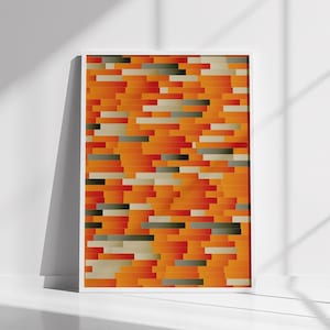 May include: Abstract geometric pattern in a framed print. The pattern is made up of orange, red, and gray rectangles.