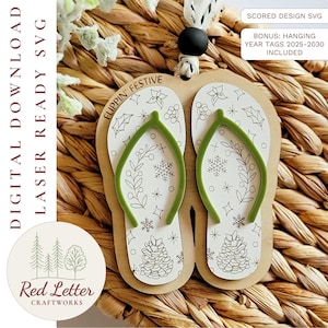 May include: A wooden Christmas ornament shaped like a pair of flip-flops, with green straps and festive winter designs. The ornament has the text "FLIPPIN' FESTIVE" and "DIGITAL DOWNLOAD LASER READY SVG". Includes year tags 2025-2030.