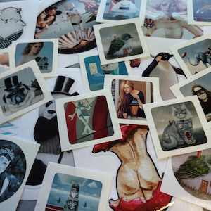 May include: A collection of square stickers featuring various illustrations. The stickers depict a pug wearing a top hat, a panda, a cat, a penguin, a bird, and other artistic images. The stickers are scattered across a surface.