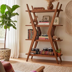 May include: A wooden bookshelf with an A-frame design, filled with books, cameras, and decorative items. The shelves are stained a warm brown color. A potted plant and a macrame wall hanging are visible in the background.