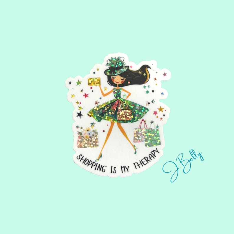 May include: A sticker featuring a cartoon woman in a green dress and hat, carrying shopping bags and a purse. The text "SHOPPING IS MY THERAPY" is displayed. The sticker has a glittery effect and star accents.