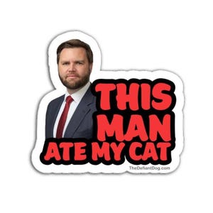 May include: A white sticker featuring a man in a suit and tie, with the text "THIS MAN ATE MY CAT" in red, outlined in black. The website address "TheDefiantDog.com" is at the bottom.