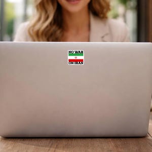 No War On Iran political peace sticker applied to laptop, waterproof vinyl protest decal