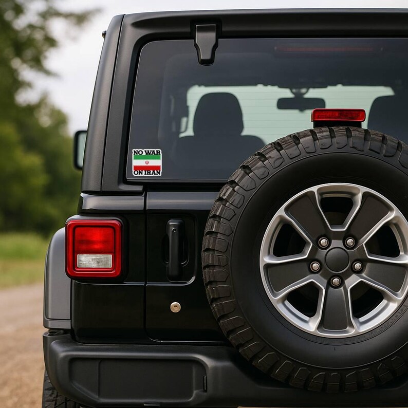 No War On Iran protest sticker displayed on Jeep rear window, anti war car decal for activism