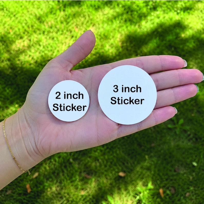 May include: Two circular white stickers with black text. The smaller sticker is labelled 2 inch Sticker and the larger sticker is labelled 3 inch Sticker. Both stickers are round and feature a clean, plain white background with bold black lettering.