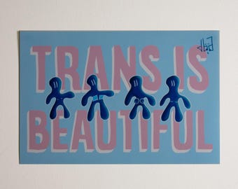 May include: A light blue sticker with the text "TRANS IS BEAUTIFUL" in pink letters. Four blue stick figures are arranged in a row below the text.