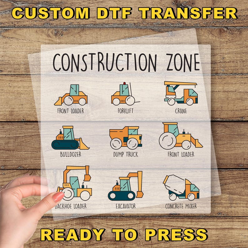 a hand holding a construction zone sticker on a piece of paper