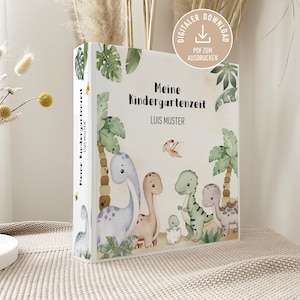 Peut inclure: Un livre pour enfants intitulé "Meine Kindergartenzeit" sur le thème des dinosaures. La couverture présente des illustrations de dinosaures, de palmiers et le nom "Luis Muster". Le livre est un téléchargement numérique.