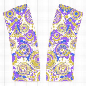 May include: Two fabric panels with a repeating pattern of concentric circles in purple, gold, and blue on a white background. The design features a mix of large and small circles, creating a dynamic and eye-catching visual effect. The panels are cut in a unique shape.