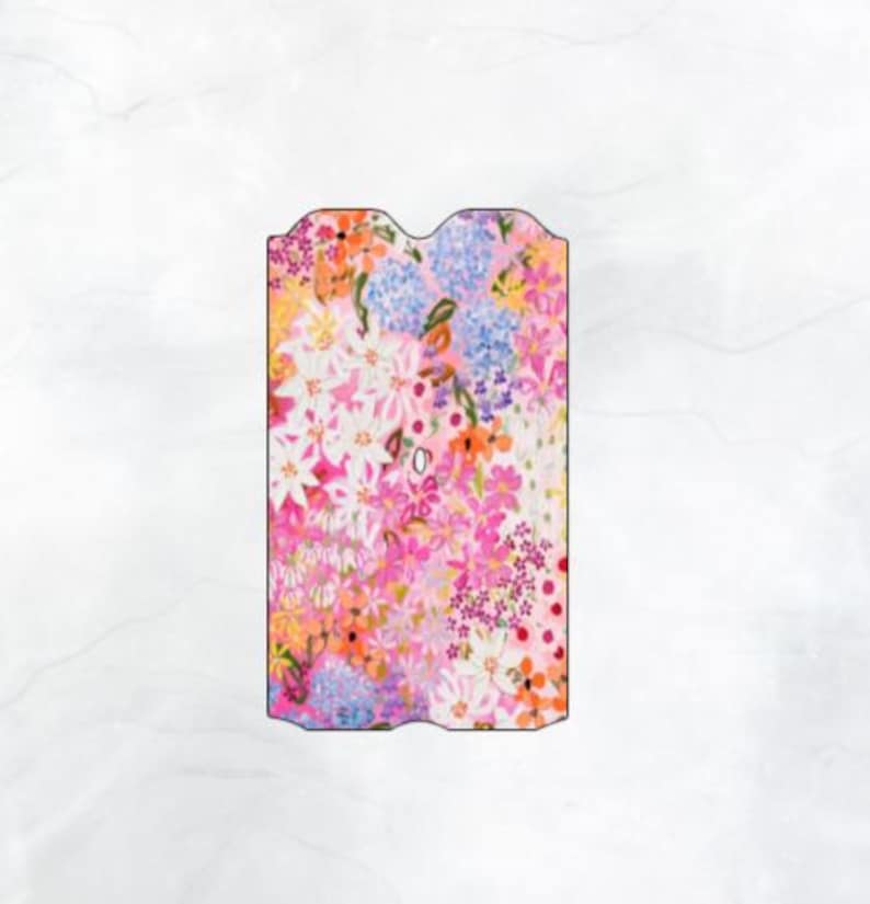 May include: A pink and white floral print with a variety of flowers, including pink, white, and blue flowers. The print is on a white background.