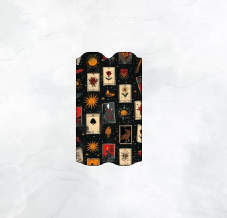 May include: Black background with a repeating pattern of tarot cards, stars, and other symbols. The cards are in various colours, including red, yellow, and blue.