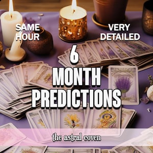 May include: A collection of tarot cards with the text "6 MONTH PREDICTIONS" and "the astral coven" on a purple surface. Lit candles and decorative items are also present, suggesting a spiritual or divination theme.