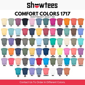 May include: A color chart of heavyweight adult tees from Showtees, featuring a wide array of Comfort Colors. The image displays a variety of shirt colors, each labeled with its name, including "Black", "Navy", and "Neon Pink".