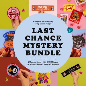 May include: A mystery bundle promotional graphic featuring a central light blue circle with the text Last Chance Mystery Bundle, surrounded by various colorful stickers and patches including a bear, a black cat, an eight ball, and text-based designs.