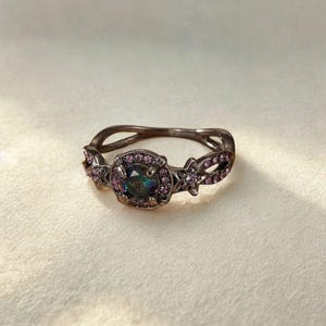 close-up of opal witch ring – mystical gothic gemstone style