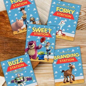 May include: Five colourful signs featuring Toy Story characters, each with a different station name: Food Station, Build Your Own Forky Station, Sweet Station, Buzz Station, and Bullseye's Branding Station.