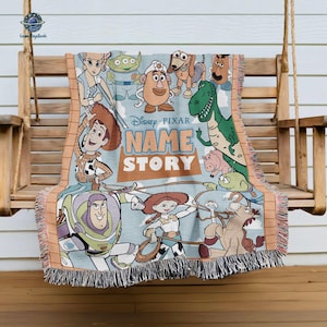 A Disney Pixar-themed blanket featuring characters from Toy Story, including Woody, Buzz Lightyear, and other beloved characters from the animated film franchise.