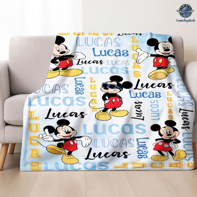 A Mickey Mouse-themed blanket with the name "Lucas" repeated across it.