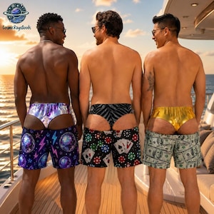 May include: Three pairs of swim shorts worn by individuals. The left pair features a purple disco ball and lightning pattern with a silver metallic waistband. The centre pair has a black and white card suit print. The right pair displays a green dollar bill pattern with a gold metallic waistband.