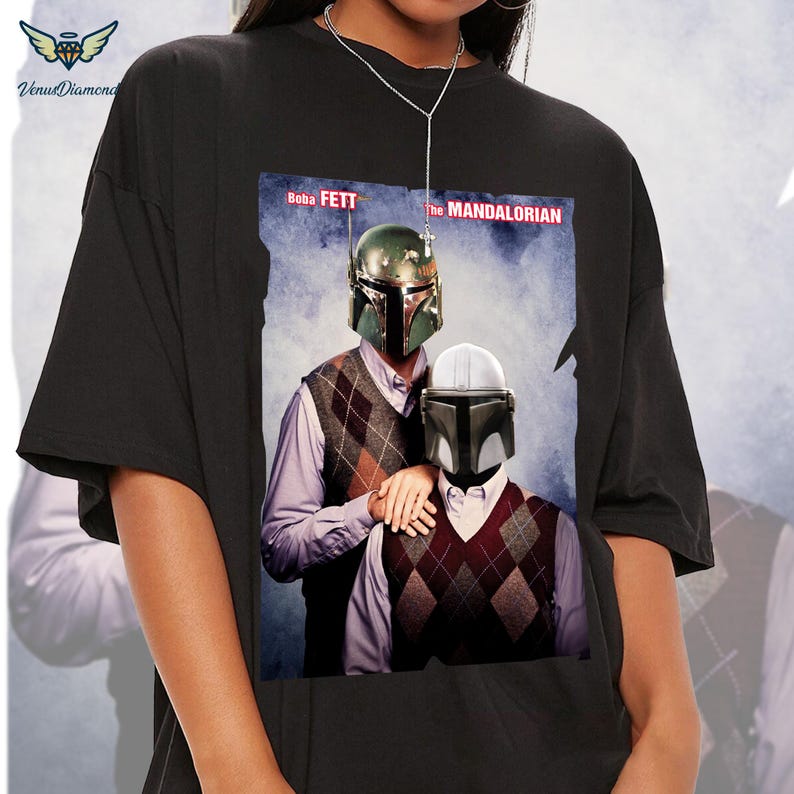 May include: Black t-shirt with a graphic of Boba Fett and The Mandalorian in a casual setting. The text "Boba Fett" and "The Mandalorian" are printed on the shirt.
