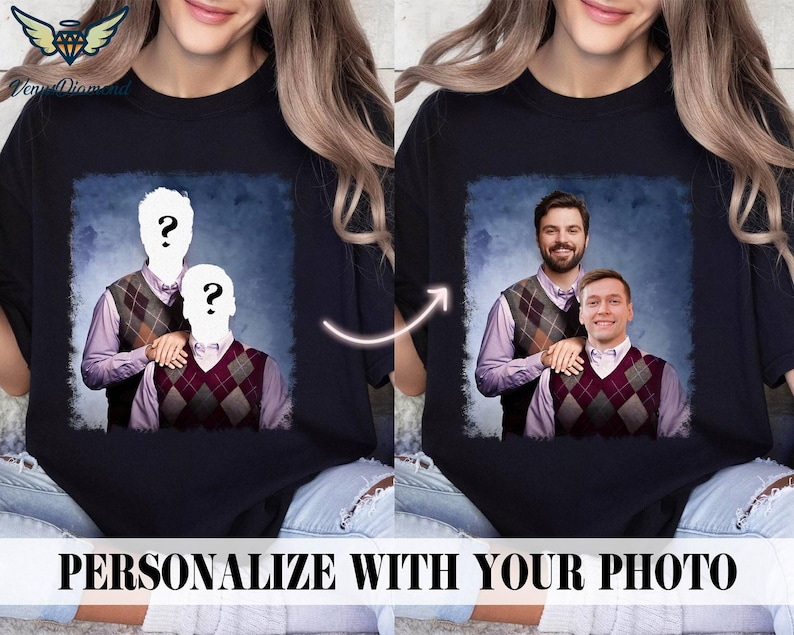 May include: A black t-shirt featuring a personalised photo of two people wearing jumpers. The photo is set against a blue and white background. The text "PERSONALIZE WITH YOUR PHOTO" is at the bottom of the image.