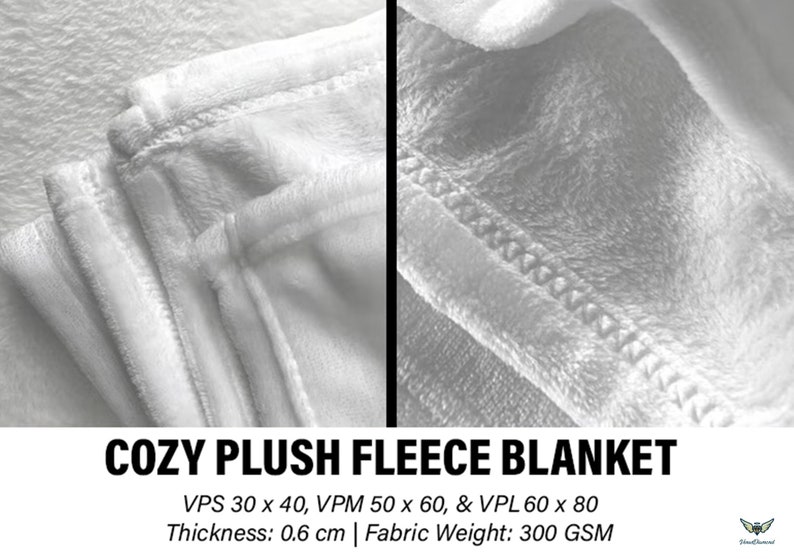 May include: Close-up of a white plush fleece blanket. The blanket has a soft, textured surface and is stitched along the edges. The text "COZY PLUSH FLEECE BLANKET" is visible at the bottom. The blanket is 0.6 cm thick.