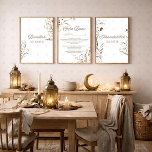 May include: Three framed prints with floral accents and text in a dining room setting. The prints are in wooden frames and feature calligraphy. The dining table is set with candles, lanterns, and a crescent moon decoration.
