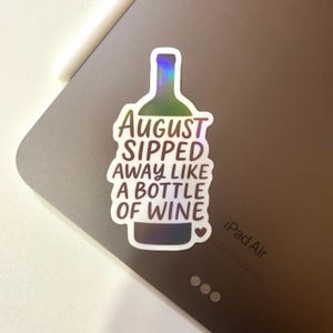 August Sipped Away Like a Bottle of Wine Sticker | Glossy Holographic Decal for Laptops, Notebooks, Water Bottles | Waterproof Vinyl Sticker