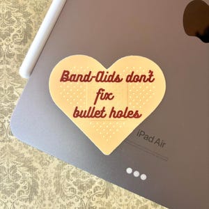 Band-Aids Don&#39;t Fix Bullet Holes Sticker | Bad Blood Sticker | Matte Vinyl Sticker | Waterproof Decal for Laptops, Water Bottles, etc.