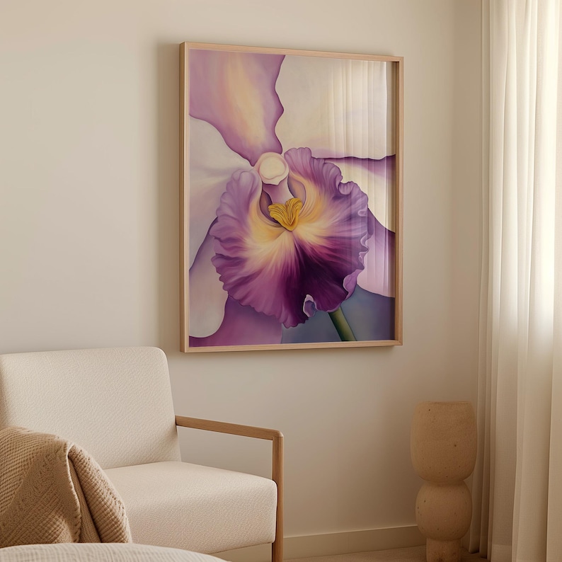 Elegant orchid painting in shades of white, purple, and yellow displayed in a light wooden frame. The artwork is mounted on a neutral wall above a light wooden bench with minimalist white vases, next to a modern cream sofa and sheer curtains.