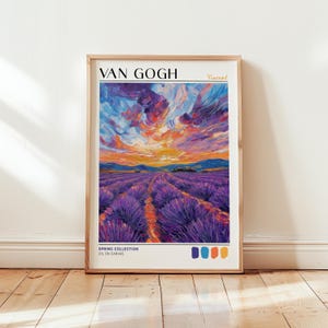 Van Gogh-style lavender field print leaning against a white wall on wooden flooring. The artwork features bold purple rows under a dramatic swirling sunset sky in orange, pink, and violet. "VAN GOGH" text and four color swatches—violet, navy, orange, and gold—line the bottom. Natural light enhances the rich brushstrokes and texture.