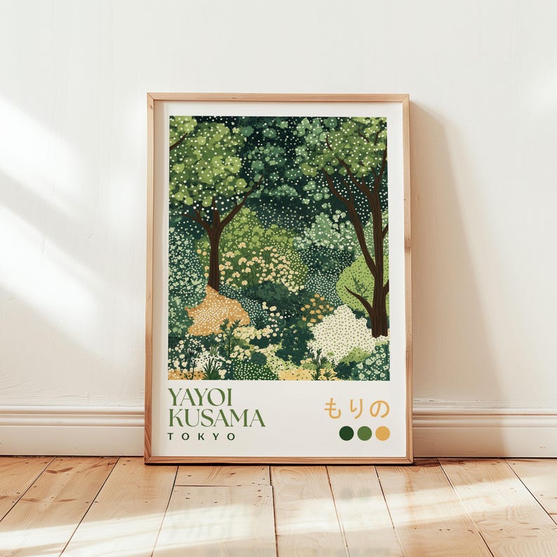 Framed Yayoi Kusama inspired forest art print featuring stylised trees and foliage in dotted patterns and layered shades of green, with Japanese text and green-yellow colour swatches, displayed against a white wall on a wooden floor