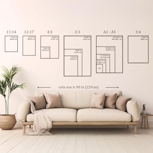 Wall art size guide above a 90-inch (229 cm) sofa, showing frame size comparisons from A5 to 24x36 inches in various aspect ratios including 11:14, 4:5, 2:3, and A1 to A5, displayed in a neutral living room setting