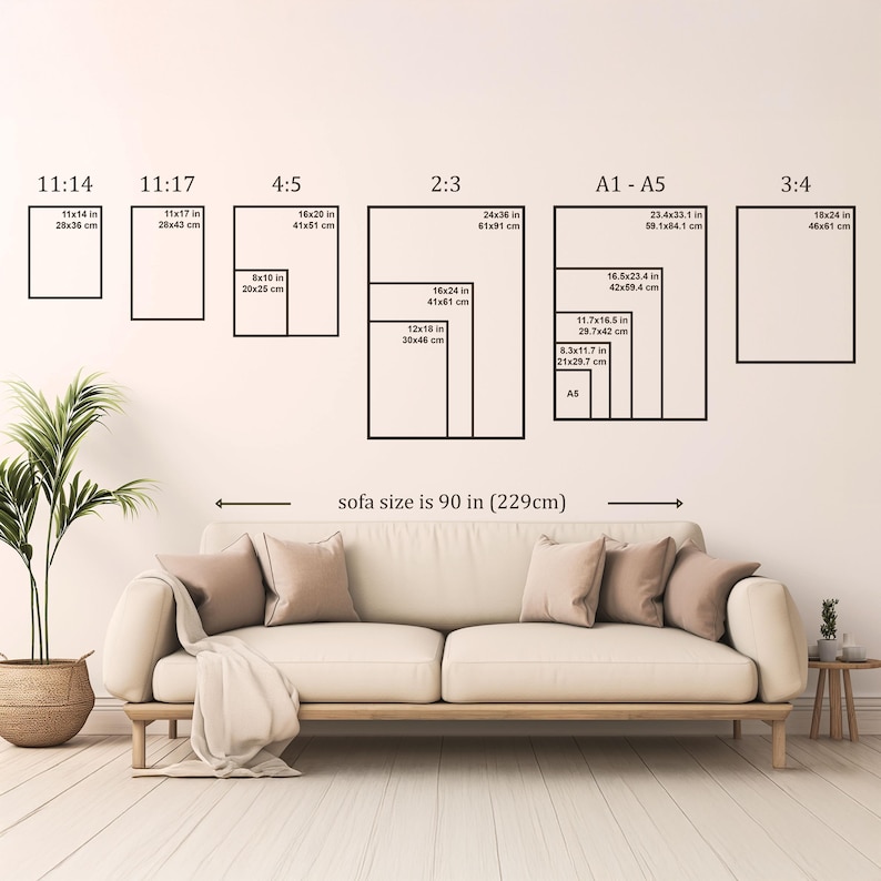 Wall art size guide above a 90-inch (229 cm) sofa, showing frame size comparisons from A5 to 24x36 inches in various aspect ratios including 11:14, 4:5, 2:3, and A1 to A5, displayed in a neutral living room setting