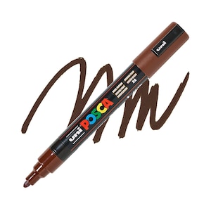 May include: A dark brown Uni Posca paint marker with a black cap and a brown tip. The marker is shown with a brown paint stroke on a white background. The marker has the words "Uni Posca" in colorful letters.