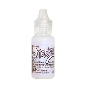May include: A clear bottle of Twinkle Stickles adhesive for paper crafting. The bottle is 18 ml and has a white label with black text that reads "Twinkle Stickles Acid Free For Paper Crafting Non-Toxic Non-Setting Easy Flow Tip Ranger Tinton Falls, NJ 07724".