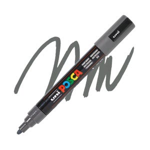 May include: A deep gray Uni Posca paint marker with a chisel tip, lying on a white background with a gray paint stroke. The marker has the text "Uni Posca" in colorful letters and "Deep Grey" printed on the side.